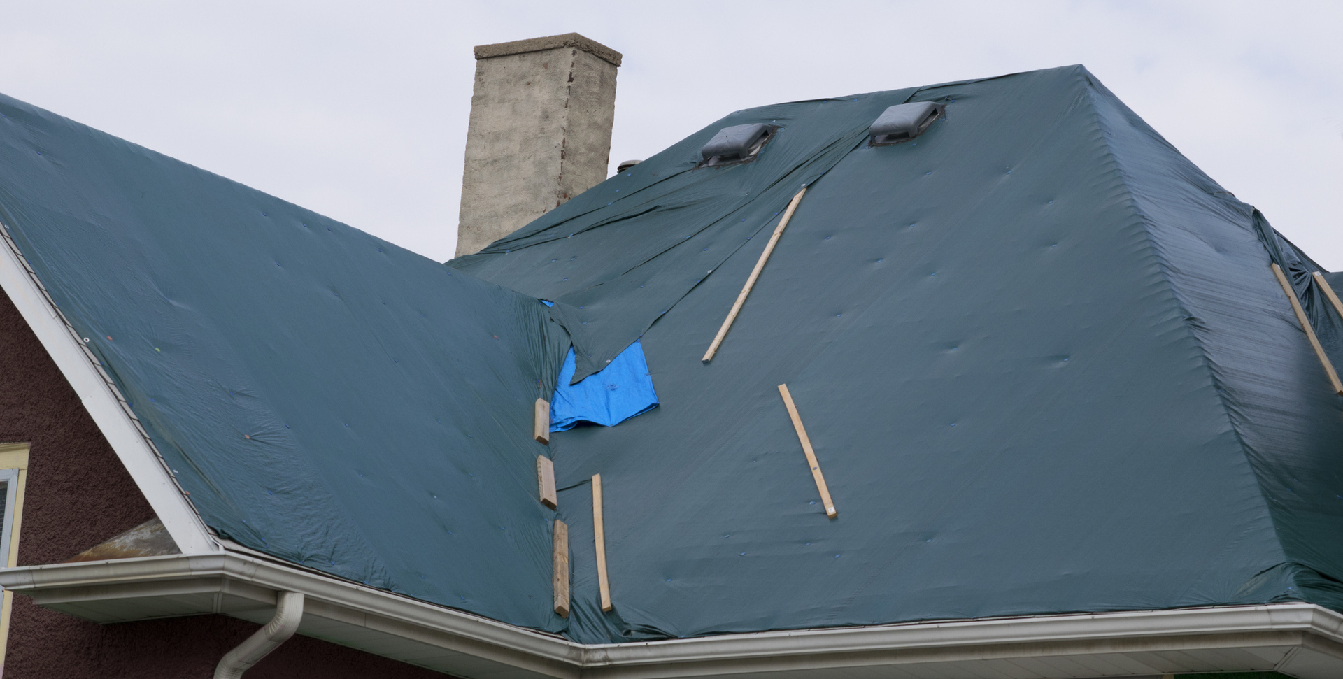 Emergency roof repair with temporary weatherproofing