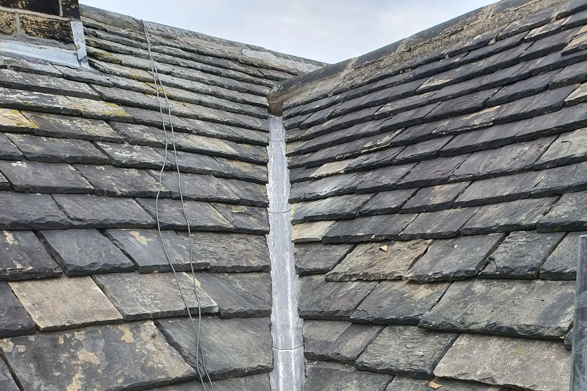 Lead valley gutter replacement on traditional roof