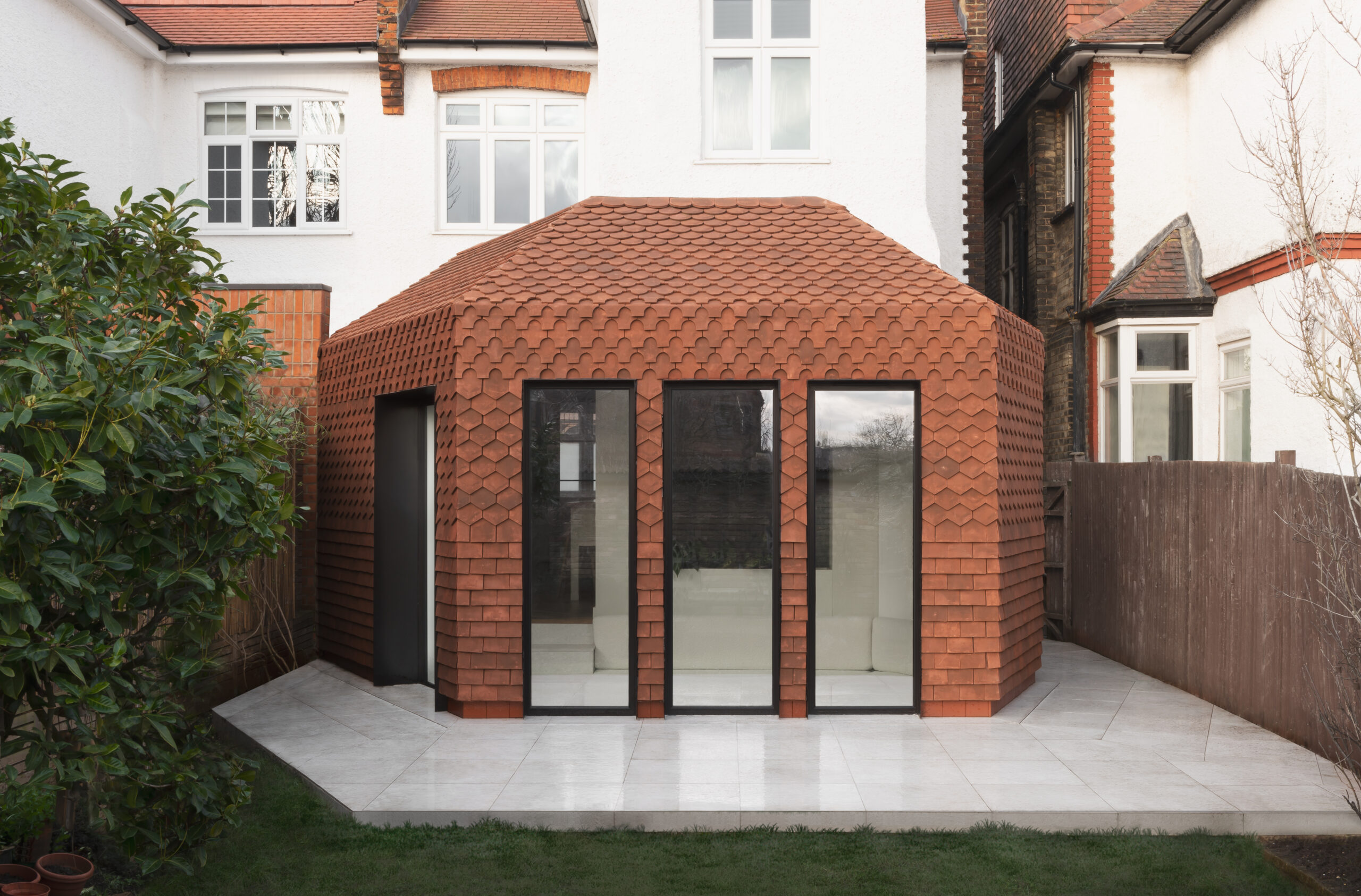 Modern property with clay tile roof